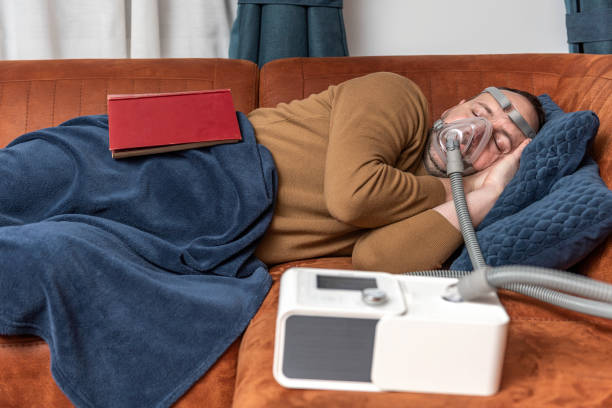 Snoring man with cpap device